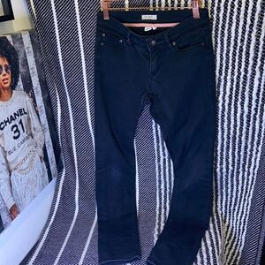 Roxy black distressed skinny jeans.